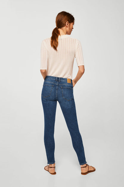 Dark blue slim denim jeans with back yoke and belt loops.