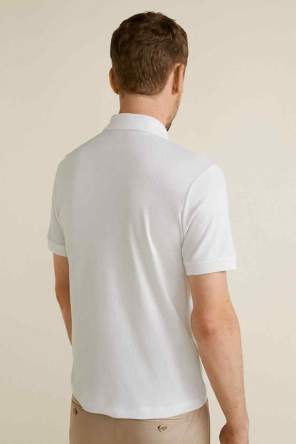 White short-sleeve polo shirt, back view, plain yoke and straight hem