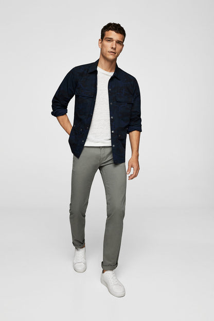 Grey slim-fit pants with belt loops and button waist