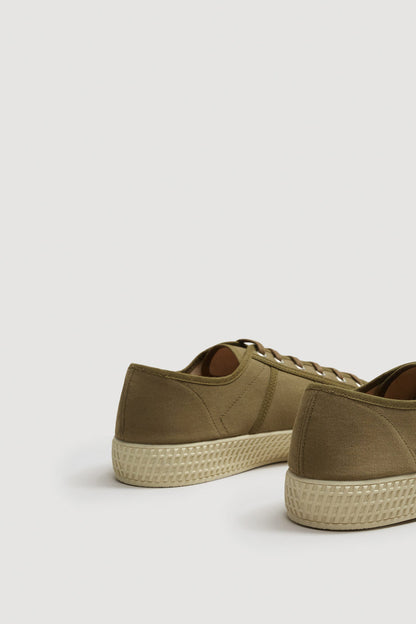Khaki canvas low-top lace-up sneakers, heel and side view, textured sole