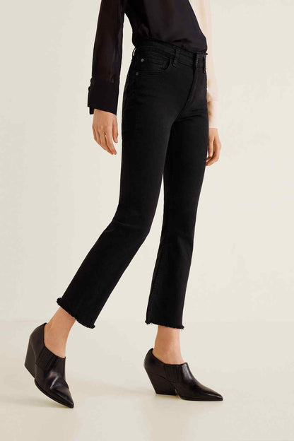 Black denim jeans with straight fit, cuffed ankle hem, and belt loops