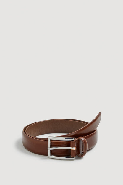 Brown leather belt with rectangular silver buckle and adjustable holes