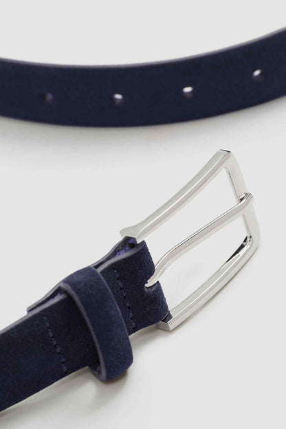 Navy suede-like belt end with silver buckle and metal pins