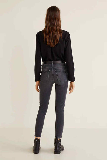 Dark gray denim jeans back view with yoke stitching and ankle cuffs