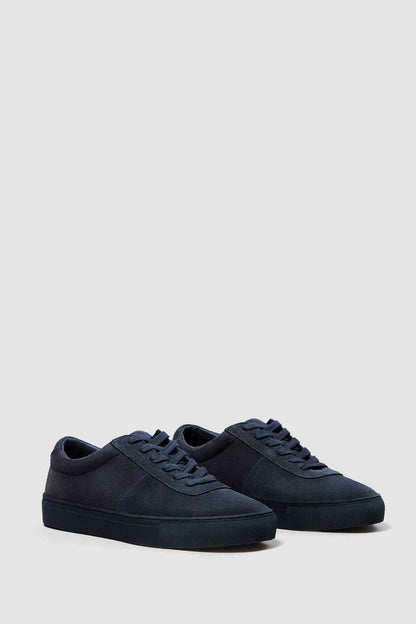 Pair of dark navy lace-up low-top sneakers with textured side panel
