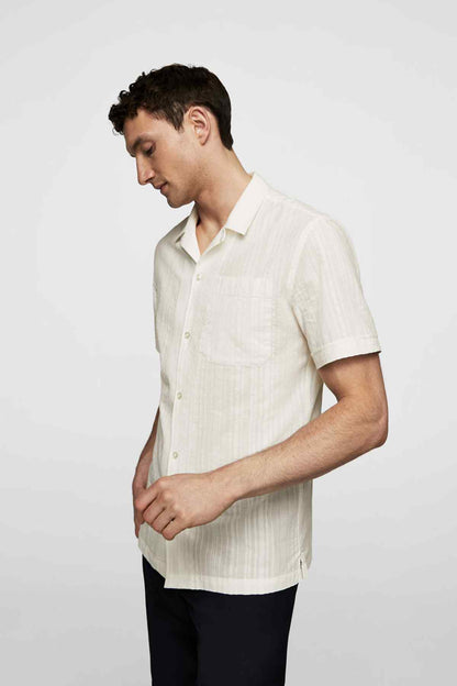 Men's off-white short-sleeve button-up shirt, side view with chest pocket