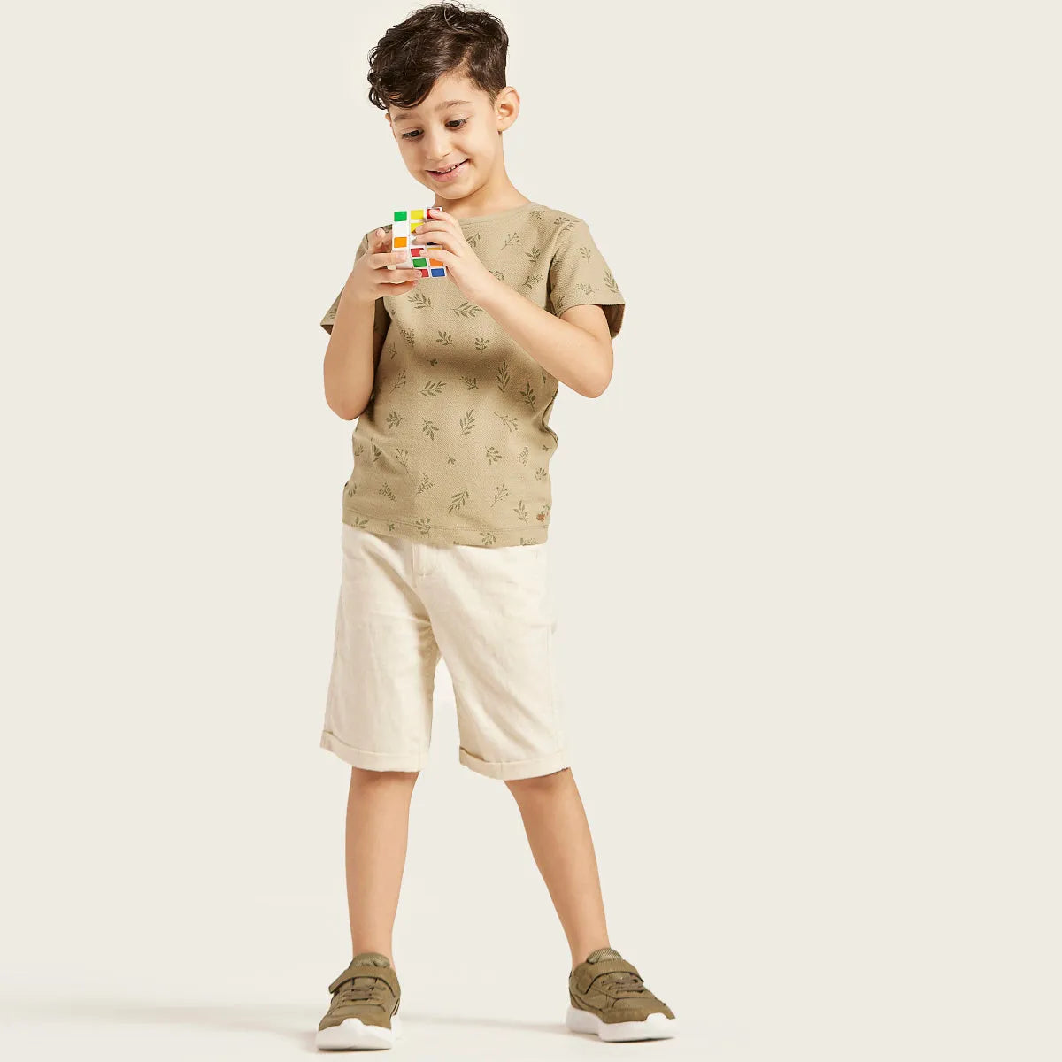 Kids T-shirt and shorts outfit: tan T-shirt with green leaf print