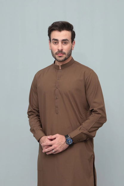 Men's brown long kurta with matching shalwar, front close portrait