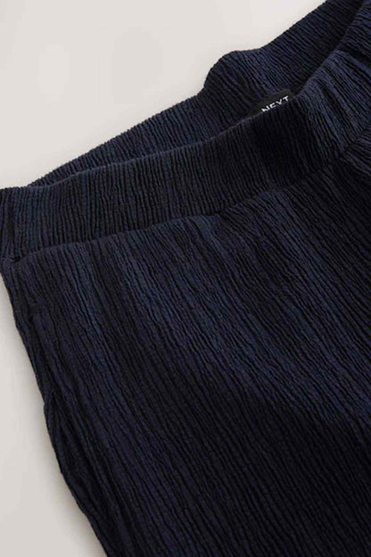 Navy trousers with elastic waistband and textured knit weave