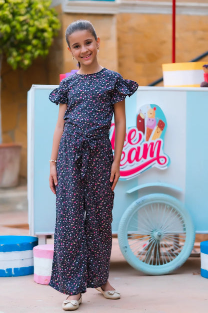 Girls' dark floral jumpsuit with ruffled sleeves and full-length wide-leg pants