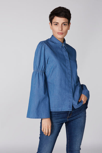 Blue denim shirt jacket with gathered sleeves and button collar