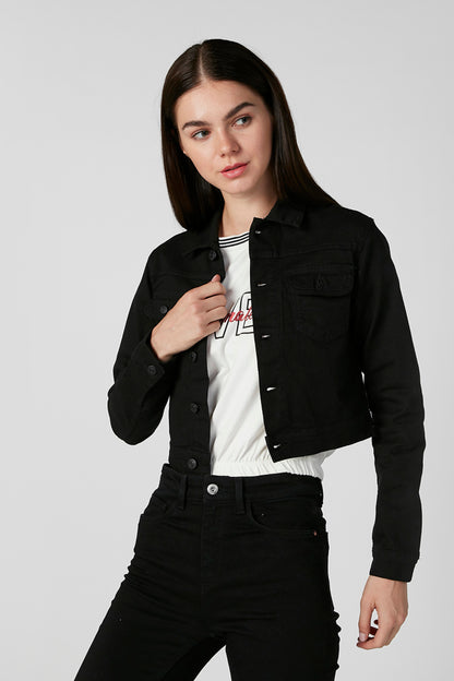 Black denim jacket with button cuffs and chest pocket, worn with black jeans