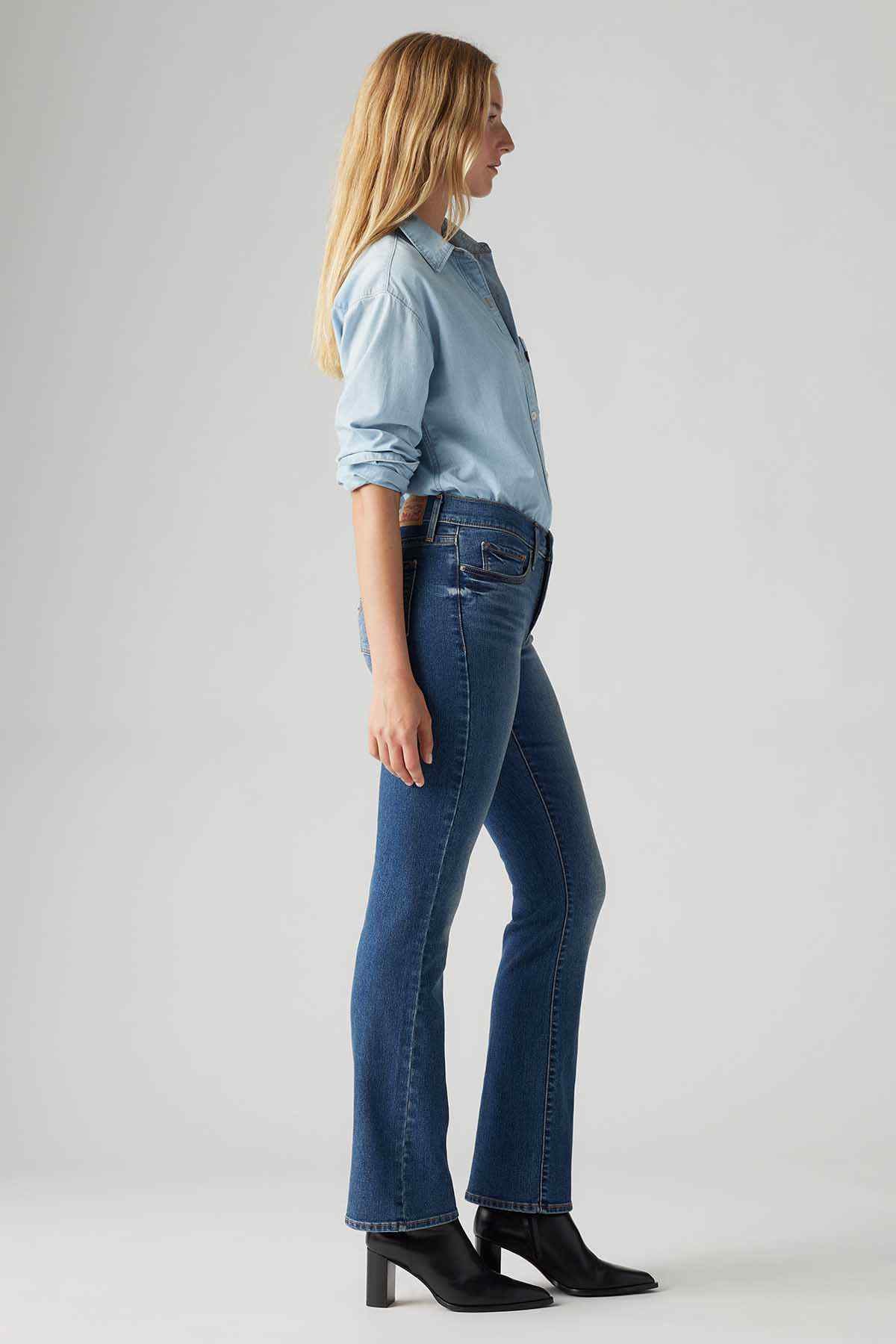 Levi's medium indigo jeans side view, straight-leg silhouette, button closure