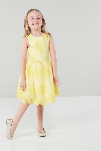 Yellow sleeveless toddler dress with floral pattern, flared hem and round neckline