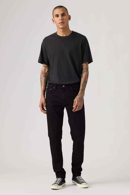 Men's black denim jeans with button fly and five pockets