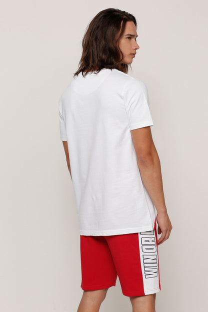 White T-shirt back view with short sleeves; red shorts with side logo