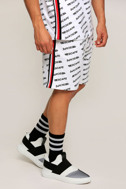 White patterned shorts with black stripe trim; striped socks and white sneakers