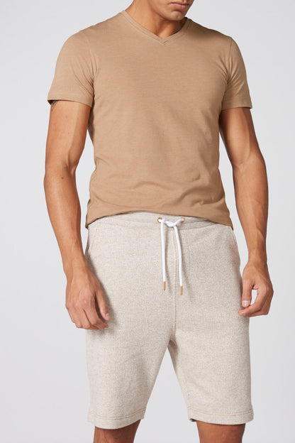 Men's tan V-neck T-shirt with heather-gray drawstring shorts and white drawcord tips