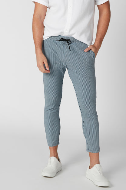 Splash cropped grey-blue pants with drawstring waist and white shirt hem