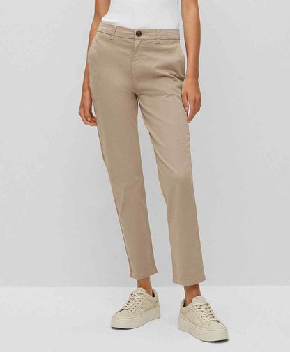 Fitted tan chinos with button closure and belt loops, tapered straight leg