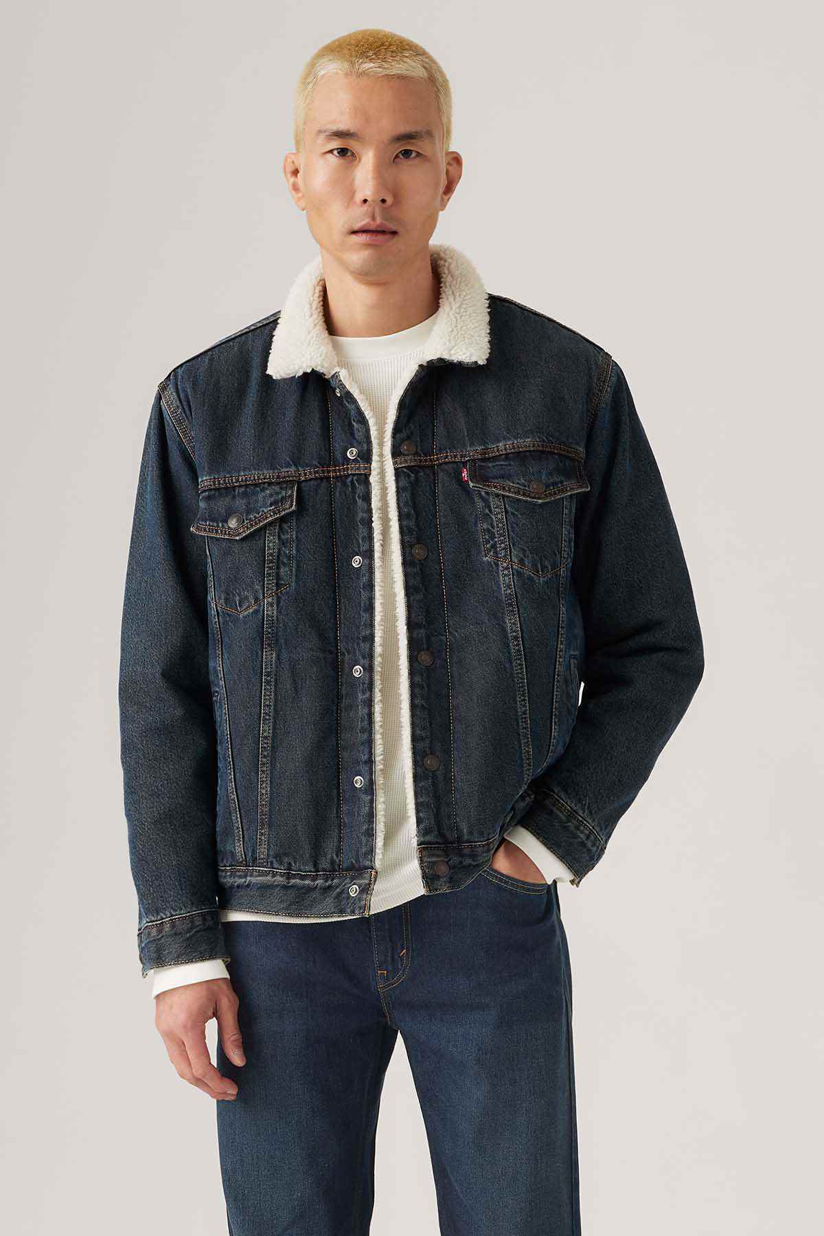 Levi's dark indigo denim jacket with sherpa-lined collar and chest pockets