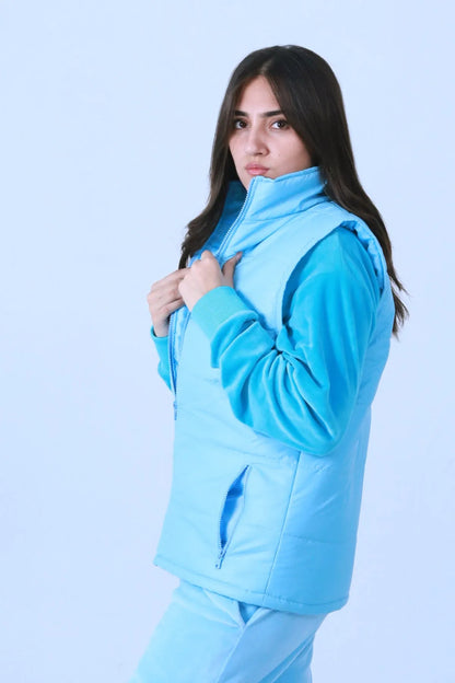 Blue quilted puffer vest with hood, close-up side view and zipper