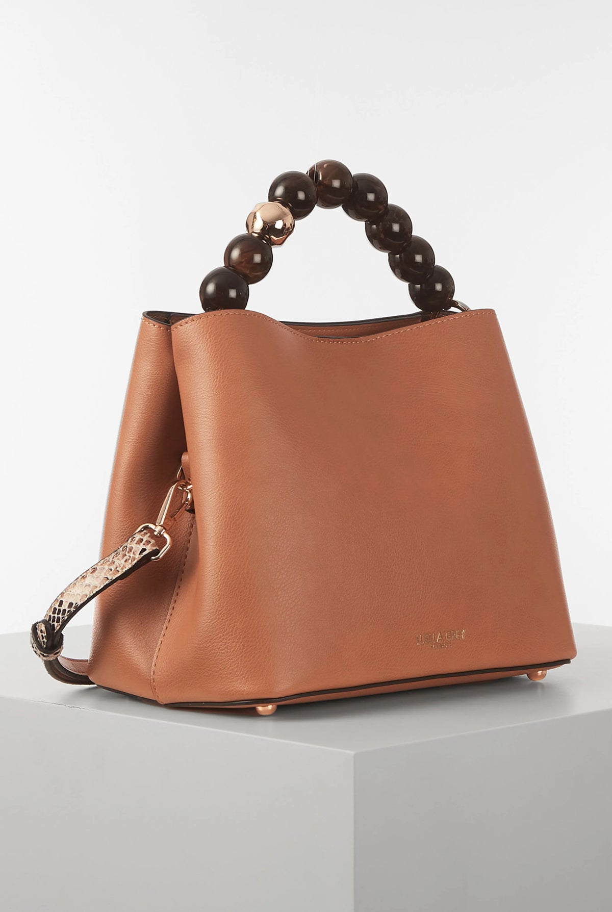 Brown leather bucket handbag with rounded beaded top handle