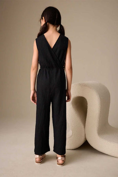 Kids black sleeveless jumpsuit with tie waist and V-back design