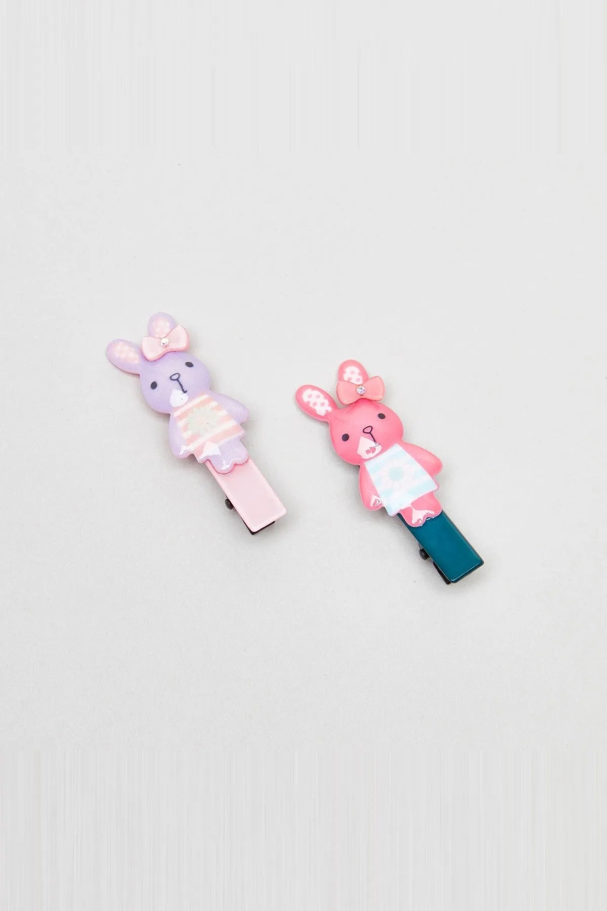 Rabbit-shaped hair clips set, pastel pink and purple with blue accents, alligator clips