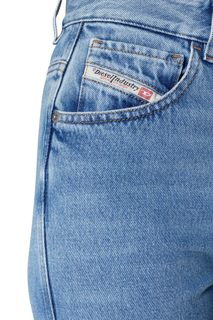 Blue denim jeans close-up of front coin pocket and logo patch