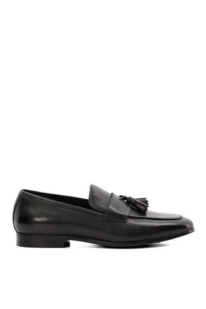 Black leather loafer with tassel fringe, heel and outsole side view