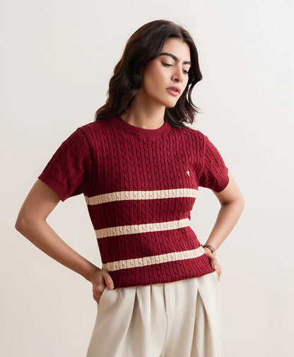 Red fitted knit crewneck top, short sleeves, cream striped bands across the chest