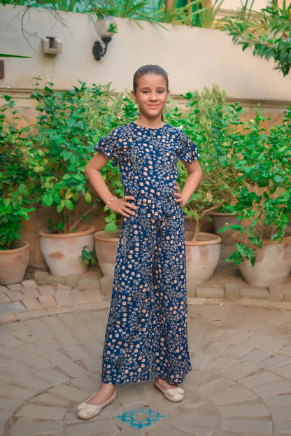 Girls' navy-blue floral jumpsuit with elastic waist and wide legs