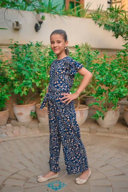 Girls' blue floral jumpsuit with gathered shoulders and loose wide-leg fit