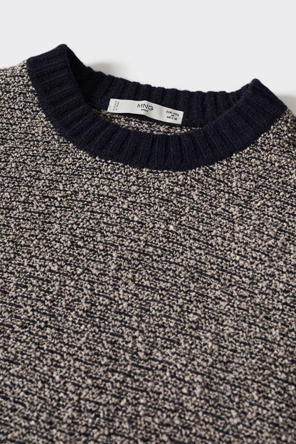 Ribbed navy crew neckline on heather gray knit sweater, close-up