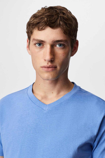Close-up of men's light blue V-neck T-shirt neckline