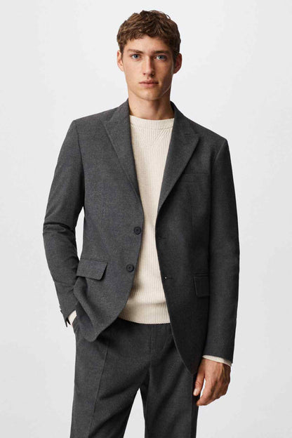 Grey suit jacket, notch lapel with two button closure and flap pockets