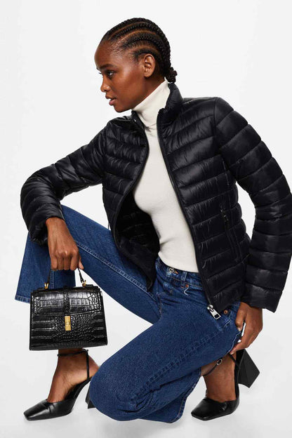 Black puffer jacket with front zipper and stand collar, quilted finish