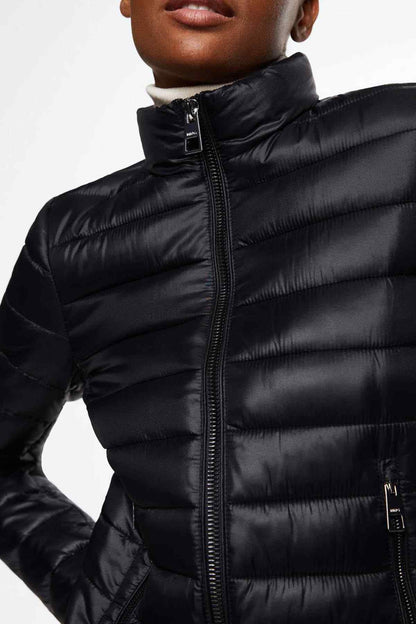Black puffer jacket collar close-up with front zipper pull