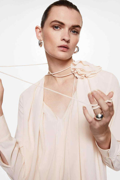 Women’s pastel pink blouse with layered ruffle collar and tie straps