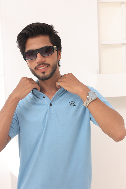 Sky blue polo shirt with embroidered chest logo and buttoned collar