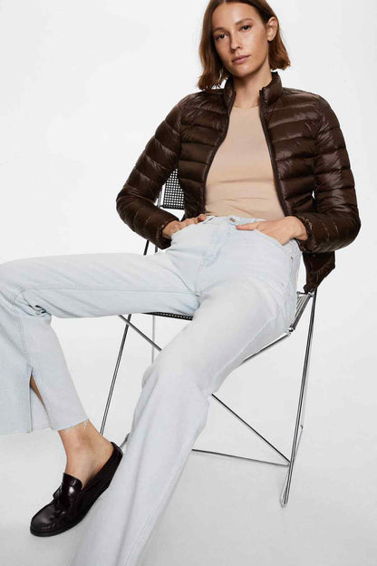 Brown quilted puffer jacket with stand collar, front pockets, and zipper