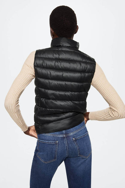 Black quilted puffer vest, back view with horizontal baffles
