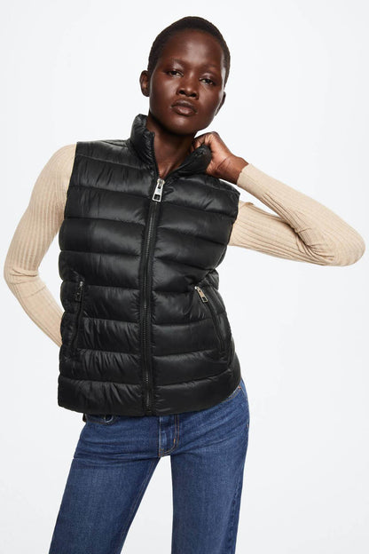 Black quilted puffer vest with front zip and stand collar