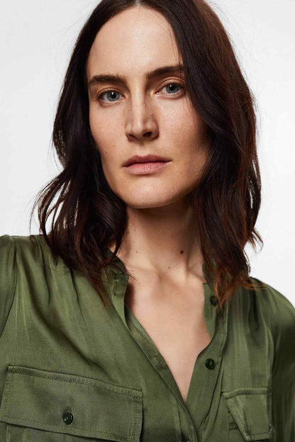 Olive-green shirt dress neckline with buttons and chest pockets