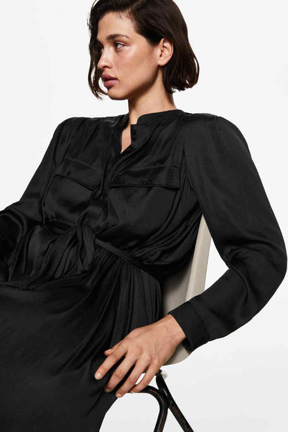 Black shirt dress side view with V placket, draped waist tie, long sleeves
