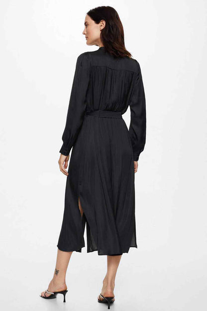 Black midi shirt dress, back view, long sleeves with gathered cuffs, tied belt
