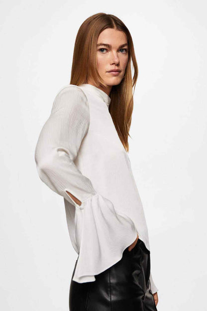 Off-white V-neck blouse with long sleeves and flared cuff ruffles.