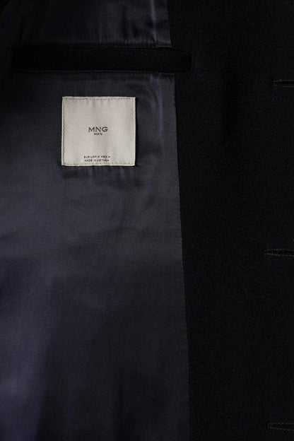 MANGO coat inner label on dark fabric pocket