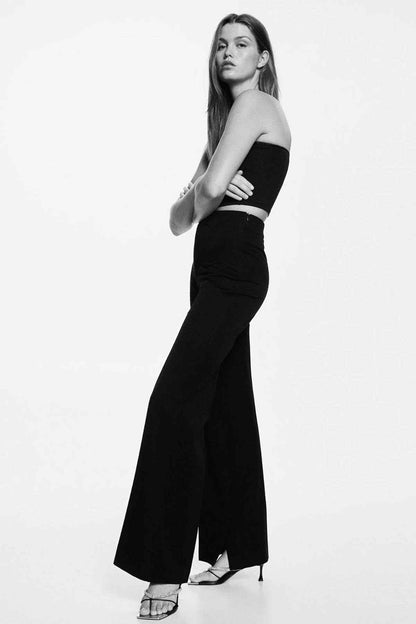 Black wide-leg trousers with center crease and flared hem